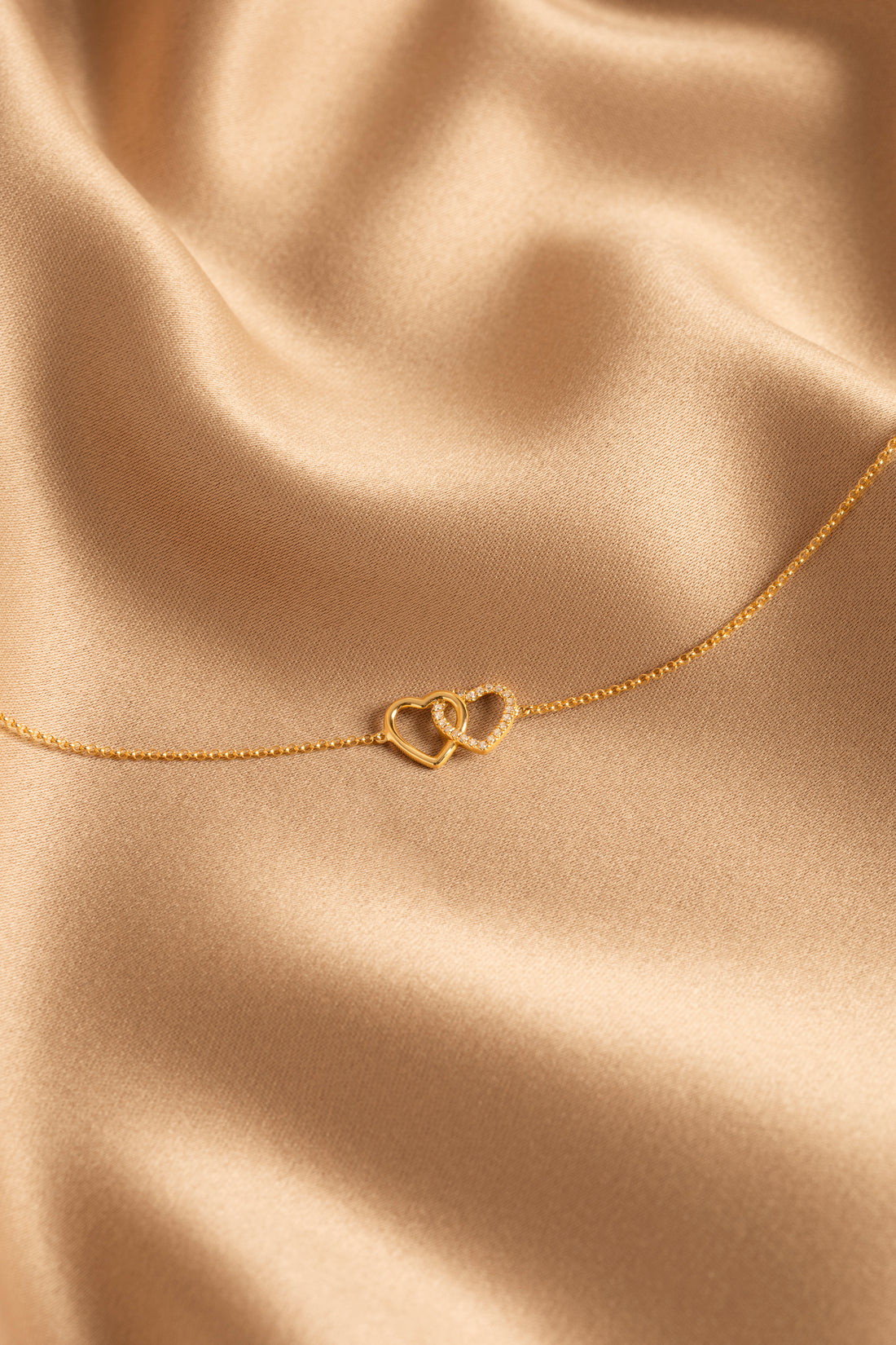 Bracelet doubles cœurs enlacés